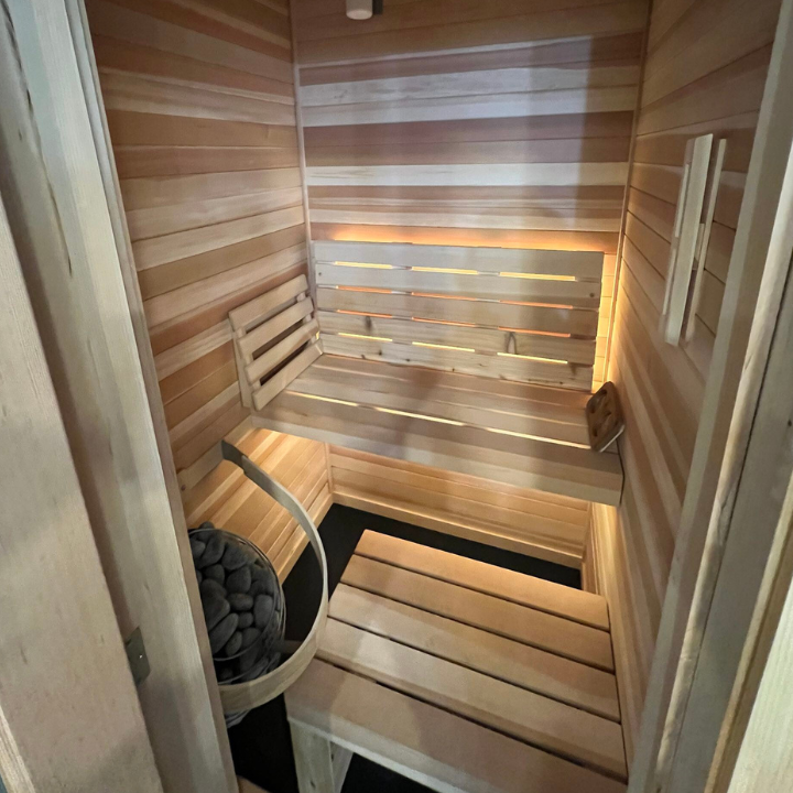 Fee Construction LLC built this beautiful custom cedar sauna in Evansville, IN — a luxury home addition featuring tiered bench seating, ambient lighting, and a traditional sauna heater. From custom builds to full renovations, Fee Construction brings your vision to life throughout Evansville and the tri-state area. Call (812) 626-1013 or get a quote at feeconstruction.com.