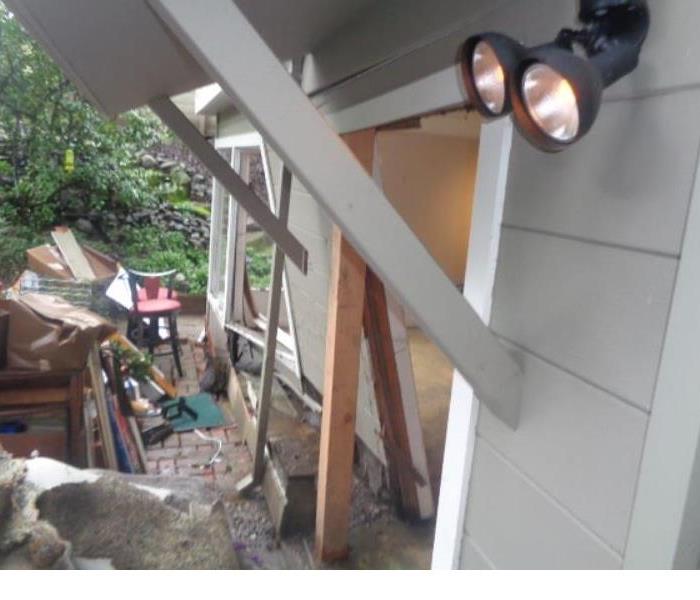 Note the temporary support beam being used to prop up a wall that was damaged by a mudslide in Burlingame.... making a location safe while we work is just pat of what we do.