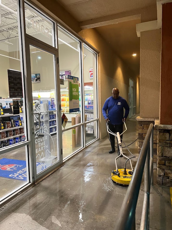 Professional storefront entrance and sidewalk pressure washing by R&R Elite removes dirt, gum, grease, algae, and stains, creating a clean, welcoming entrance that enhances curb appeal and customer impressions.