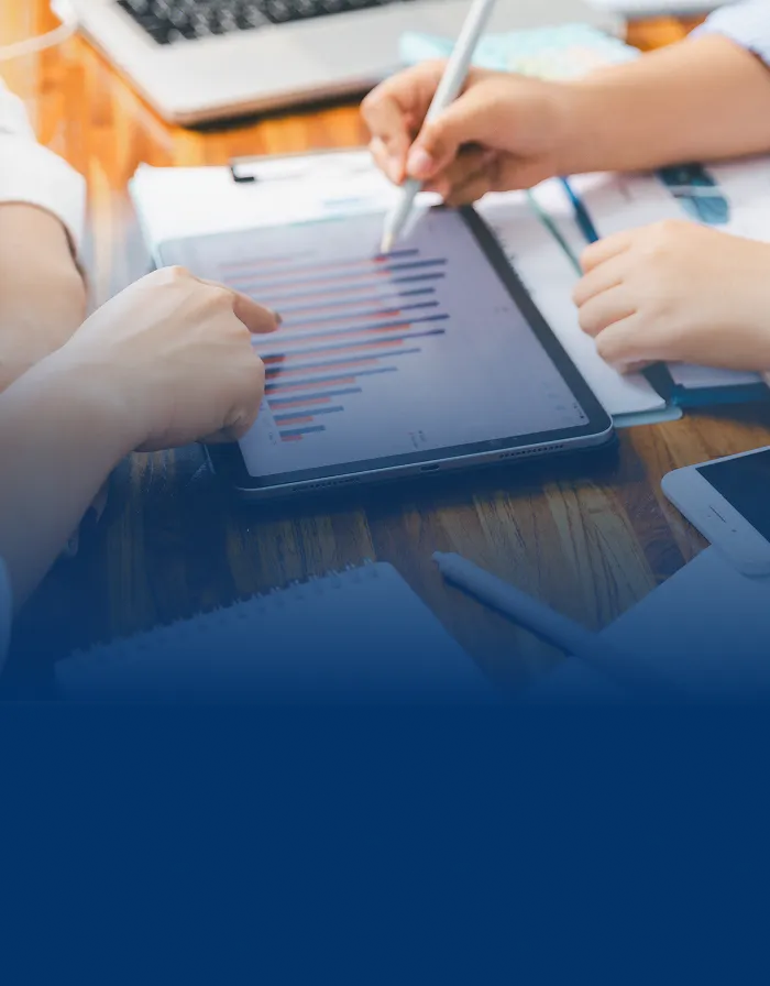 Close up of a portfolio manager and client reviewing charts.