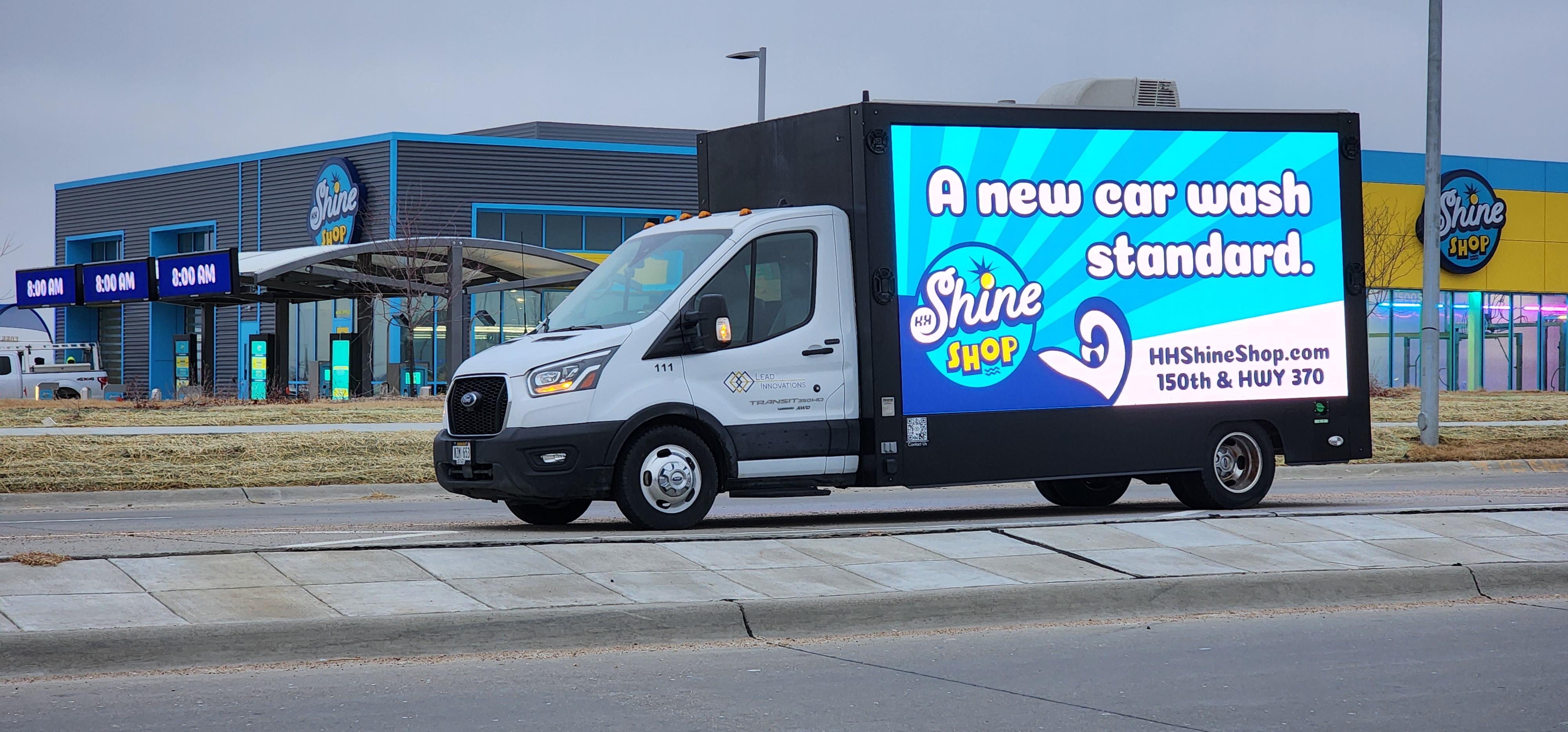Lead Innovations mobile digital billboard truck in Omaha NE with ad for H&H Shine Shop