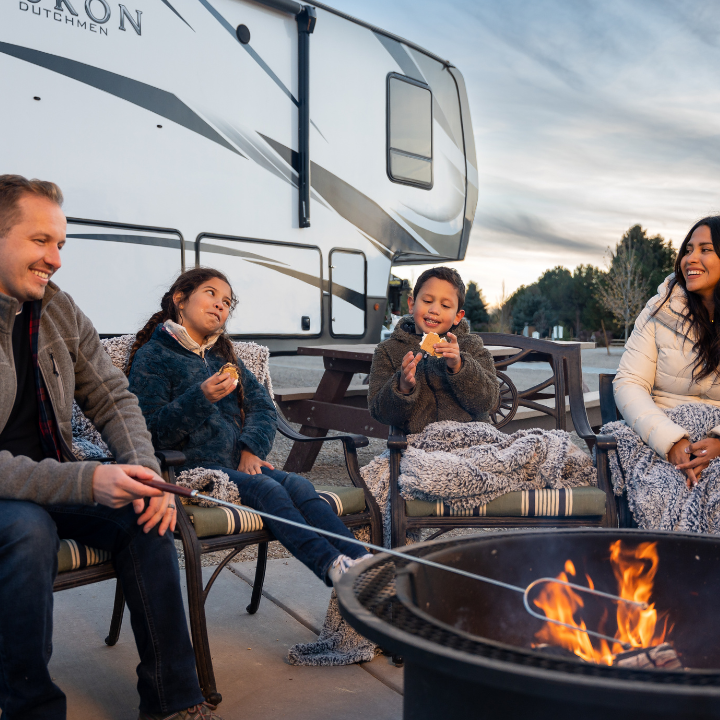 Family enjoying private firepit at Little America's RV Park.