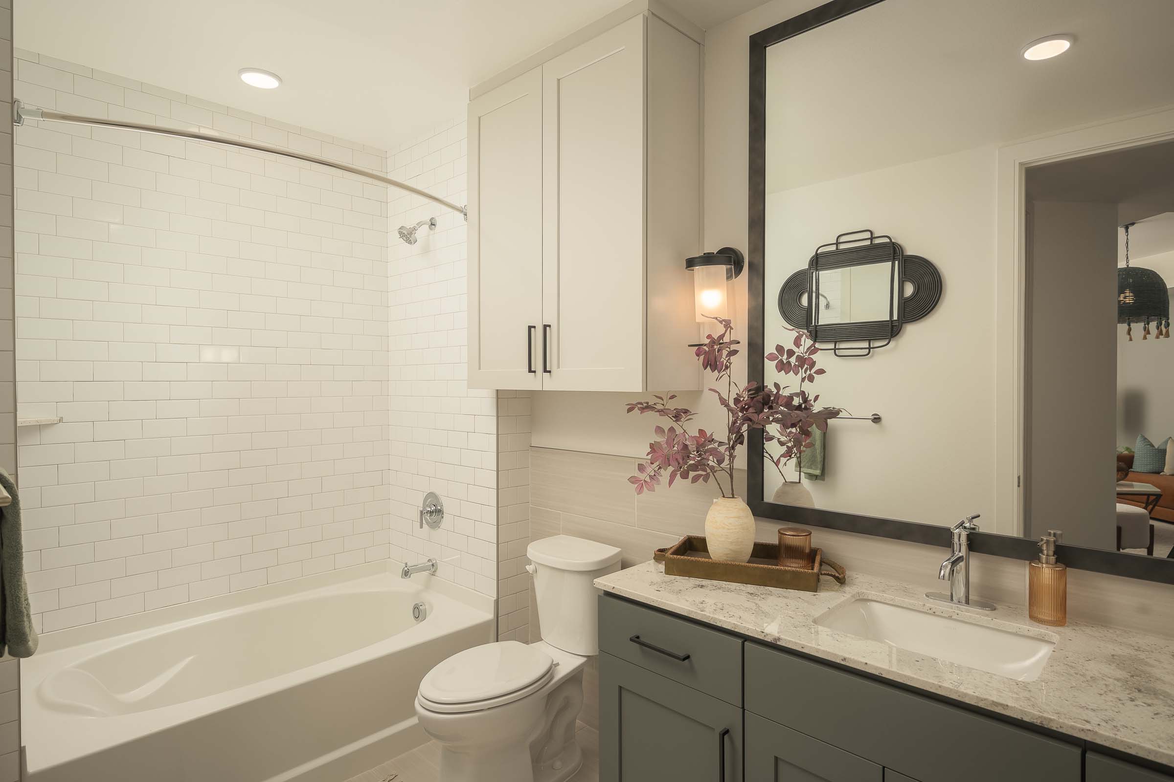 Bathroom with bathtub and curved shower rod at Camden Gilbert apartment homes in Gilbert, AZ