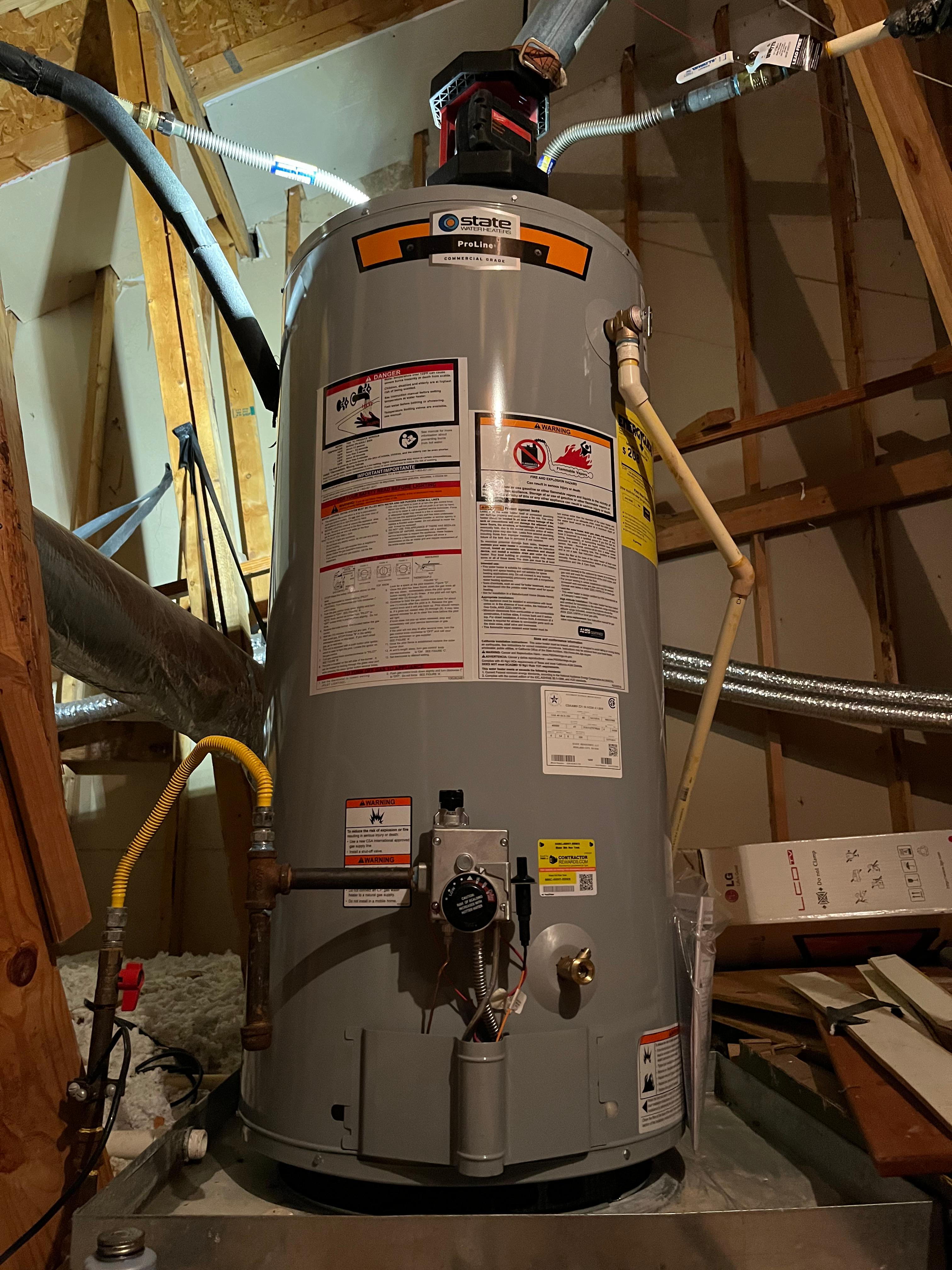 New 40 gallon short natural gas water heater in the attic. Repair Plumber MVP Plumbing Plumber Baytown Plumber Mont Belvieu Plumber Anahuac Plumber