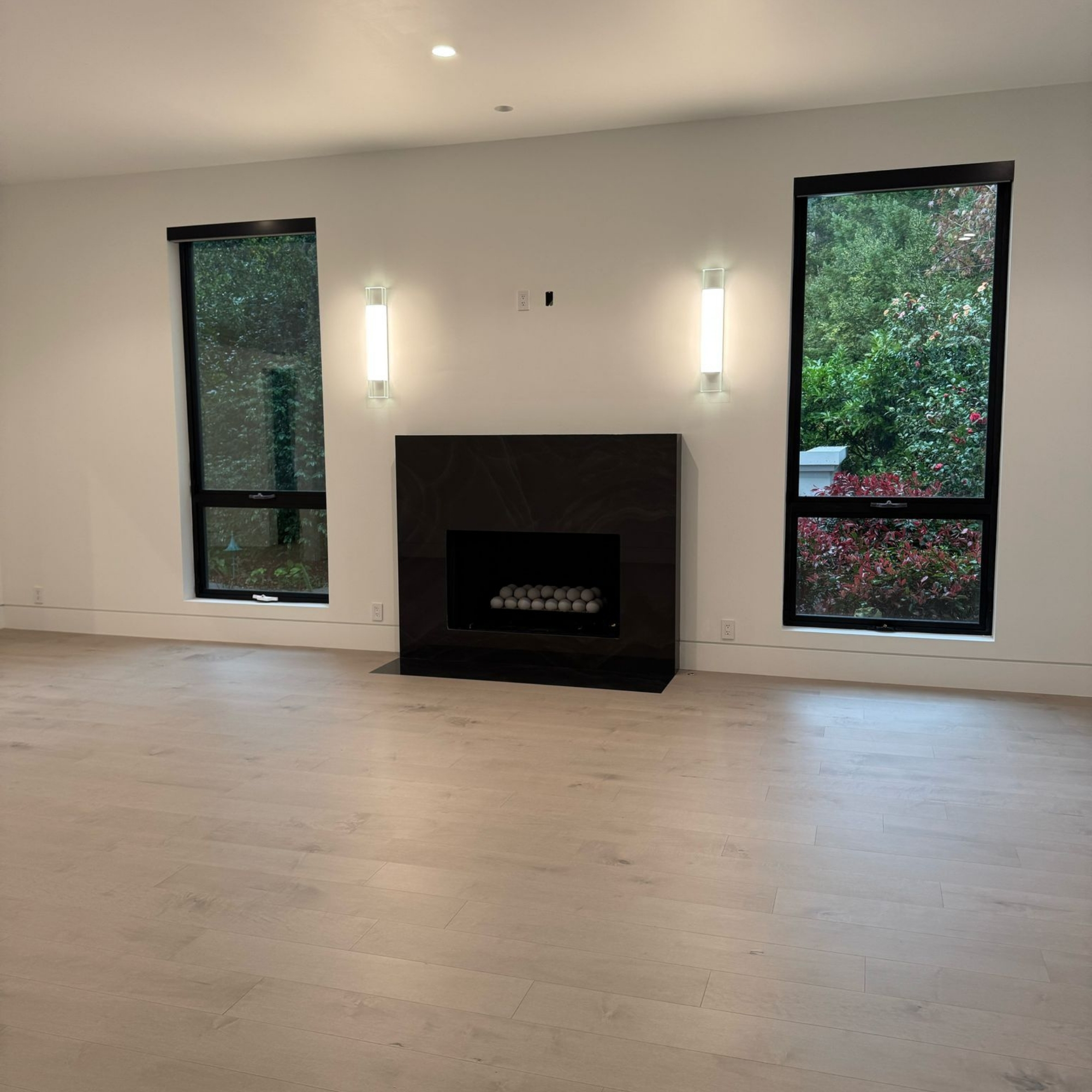 Bedroom with a modern fireplace.
