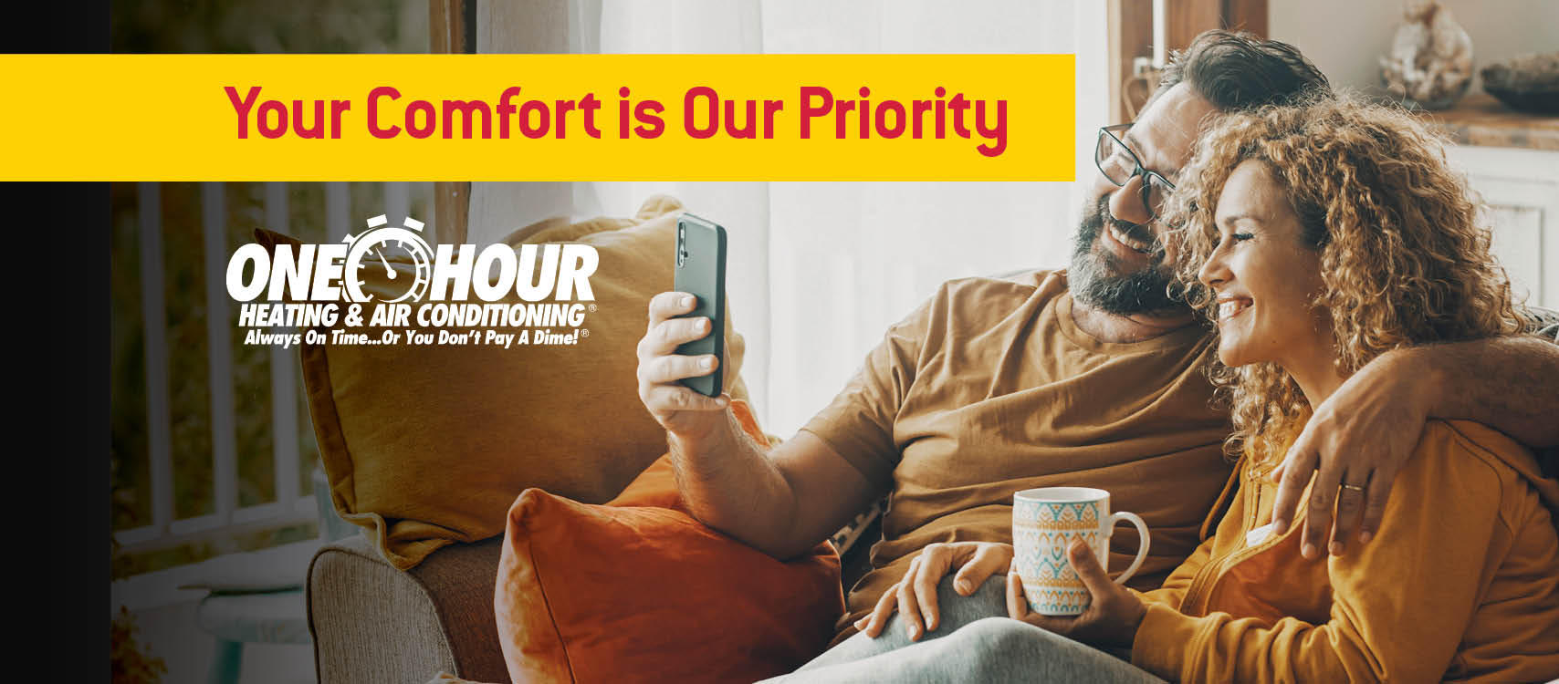 Couple sitting on a couch looking at a phone, drinking coffee, & smiling with the overlay text that says Your Comfort is Our Priority with the One Hour logo | One Hour Heating & Air Conditioning |  Proudly serving  Cedar Park, Leander, Liberty Hill, & Lago Vista, TX and surrounding areas