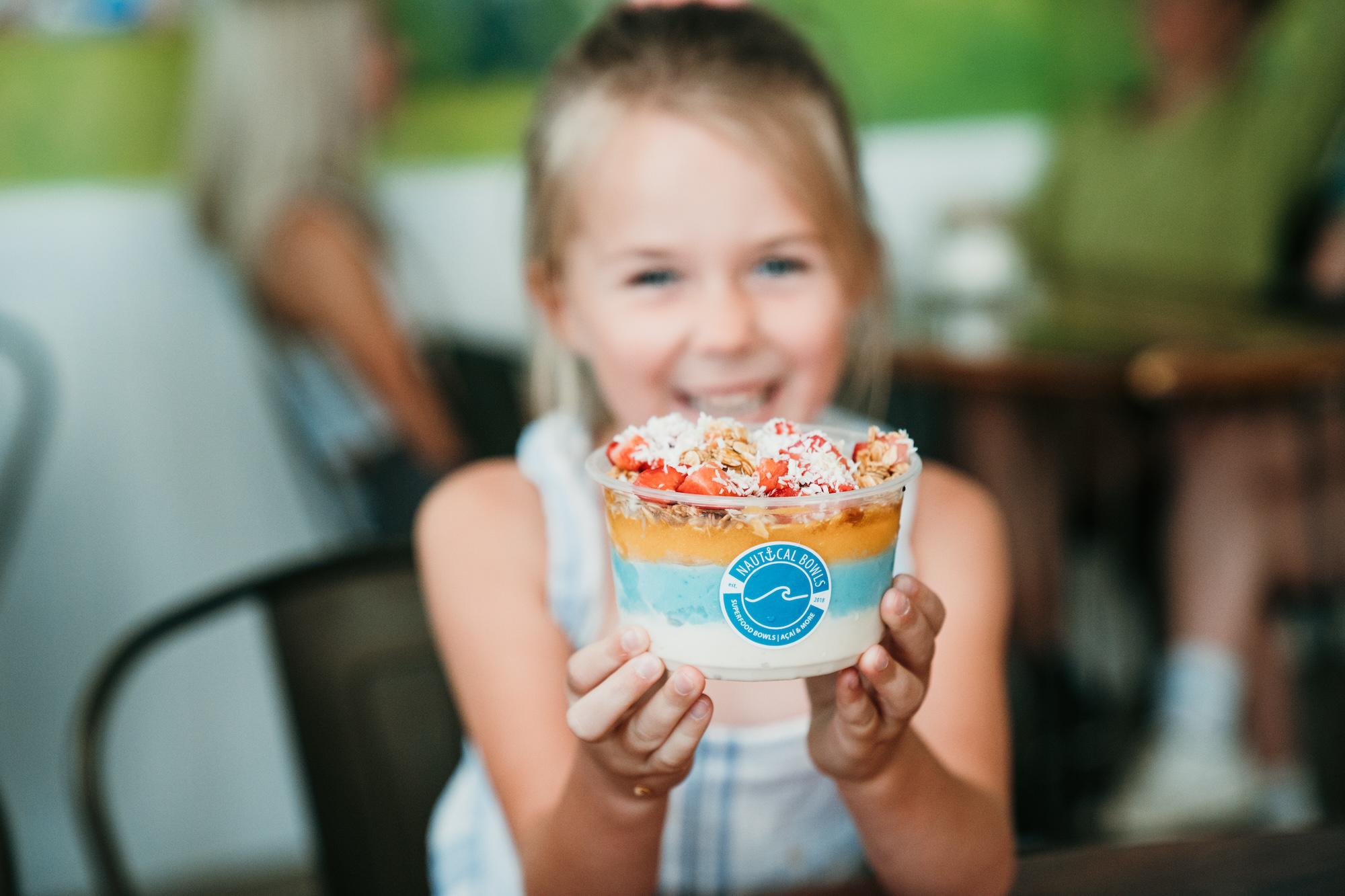 A vacation in a bowl! The Paddle Bowl is a crowd favorite with its many layers of tropical oasis. Combining Blue Majik, Coconut and Mango bases with crunchy granola, strawberries, coconut flakes & a swirl of honey, this bowl is sure to leave you full and excited for your next visit!
