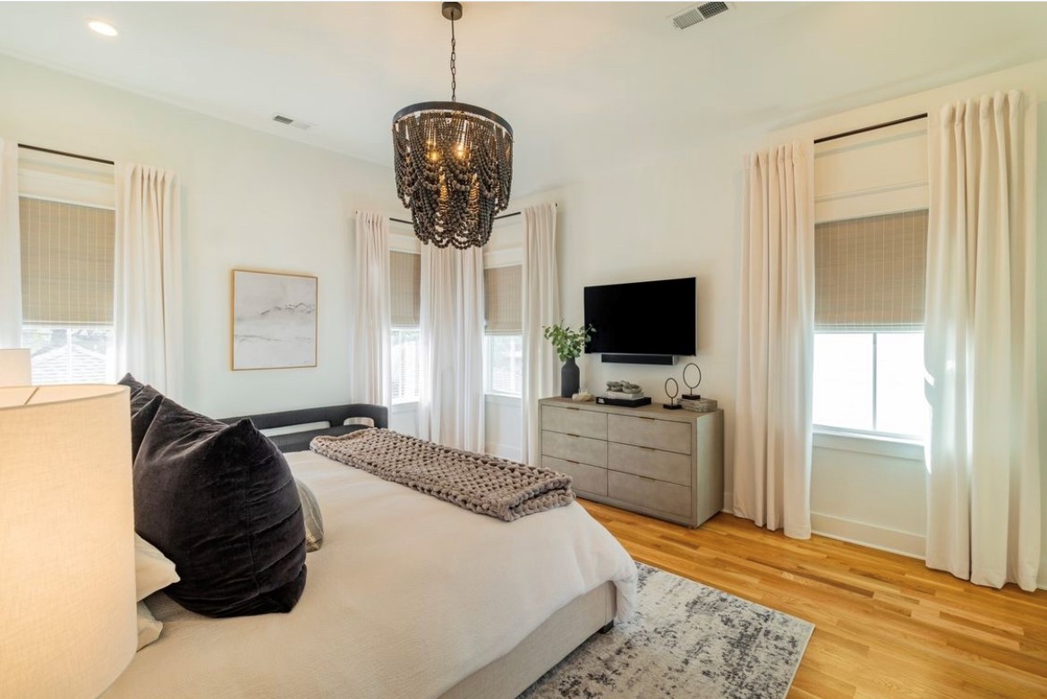 Drapery paired with woven woods add the WOW factor to any bedroom space. The wide variety of colors and textures that Budget Blinds of Rockwall, Terrell, Forney, and Greenville offer will have your windows stealing the show.