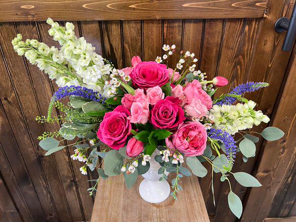 This lovely arrangement has all favorites, hydrangeas, roses and tulips with the unique texture of veronica, snapdragons and baby eucalyptus in our 5.5