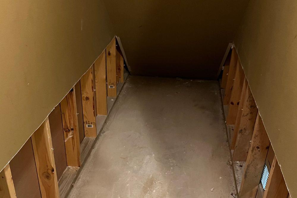 Pictured here is Minneapolis water damage under the basement stairs landing.