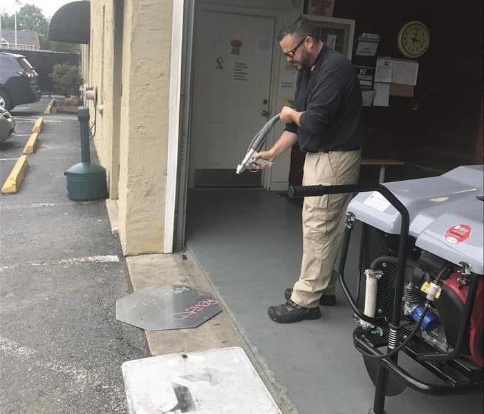 Here is Sean using the sand blasting technique to remove graffiti from street signs. We can use multiple machines to perform this work but he choose this and the results show. We were able to remove it 100% for the town.
