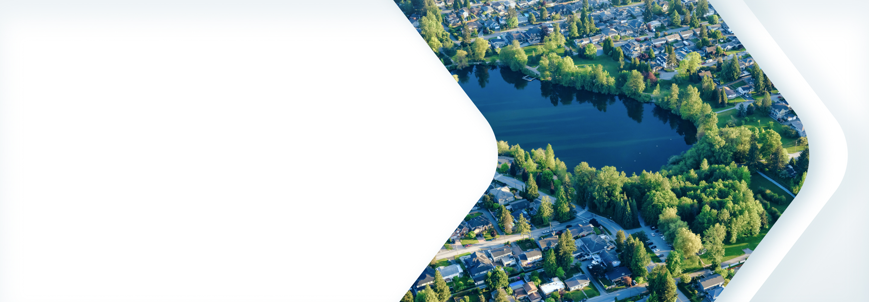 Aerial view of a neighbourhood and a pond in Coquitlam, British Columbia.