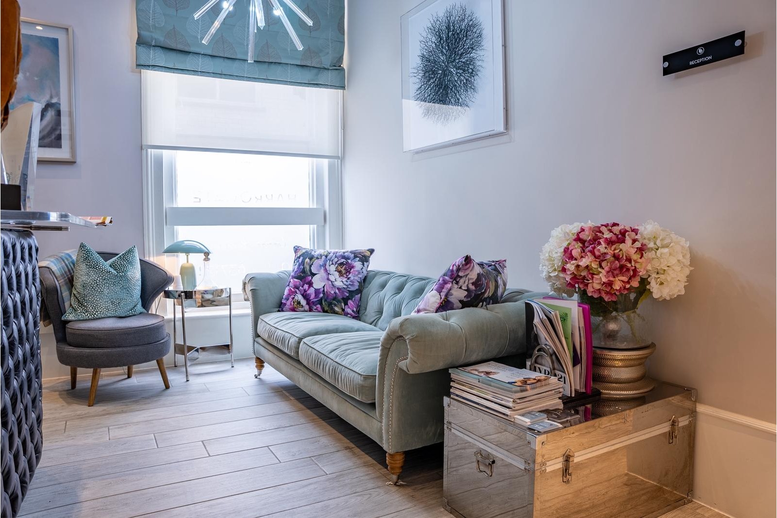 Stylish patient lounge at The Harrogate Clinic with comfortable seating, modern d&eacute;cor, and a warm homely atmosphere, designed to help patients relax before their dental or cosmetic treatment in Harrogate, North Yorkshire.