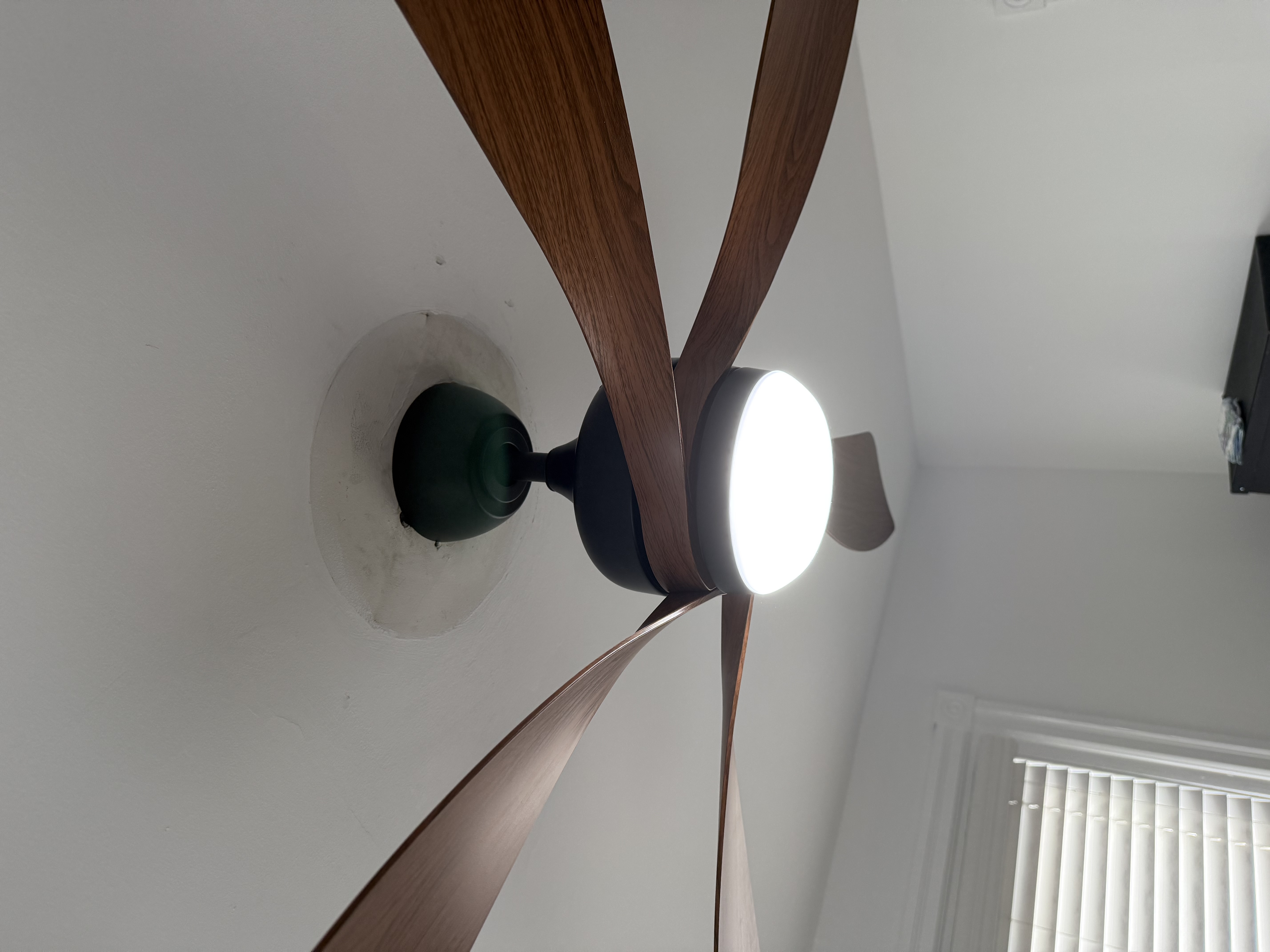 Thomas Edison Electric installed a modern five-blade ceiling fan with an integrated LED light in a Drexel Hill, PA bedroom. The matte black motor and walnut-toned blades give the fan a sleek, contemporary look while keeping the room comfortable year round.