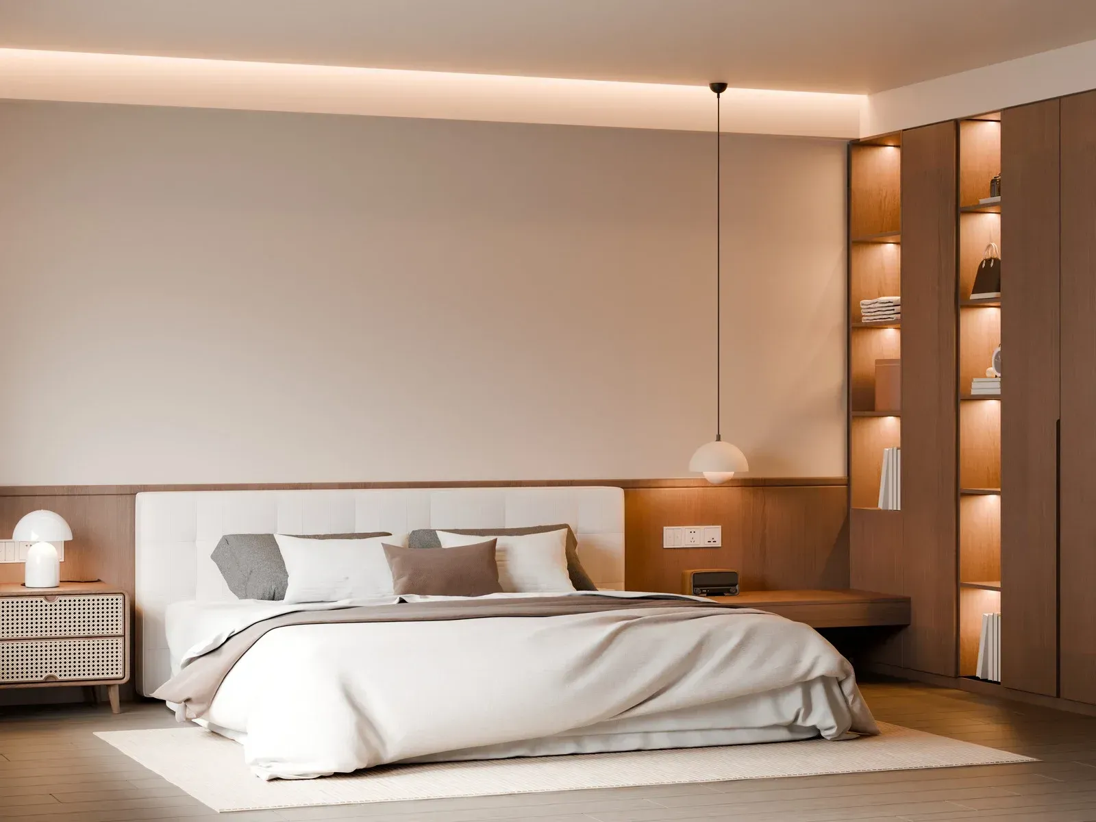 Elegant bedroom with warm lighting, upholstered bed, wooden panel accents, built-in shelving, pendant light fixture, and soft neutral palette, showcasing modern interior craftsmanship and comfortable residential design.
