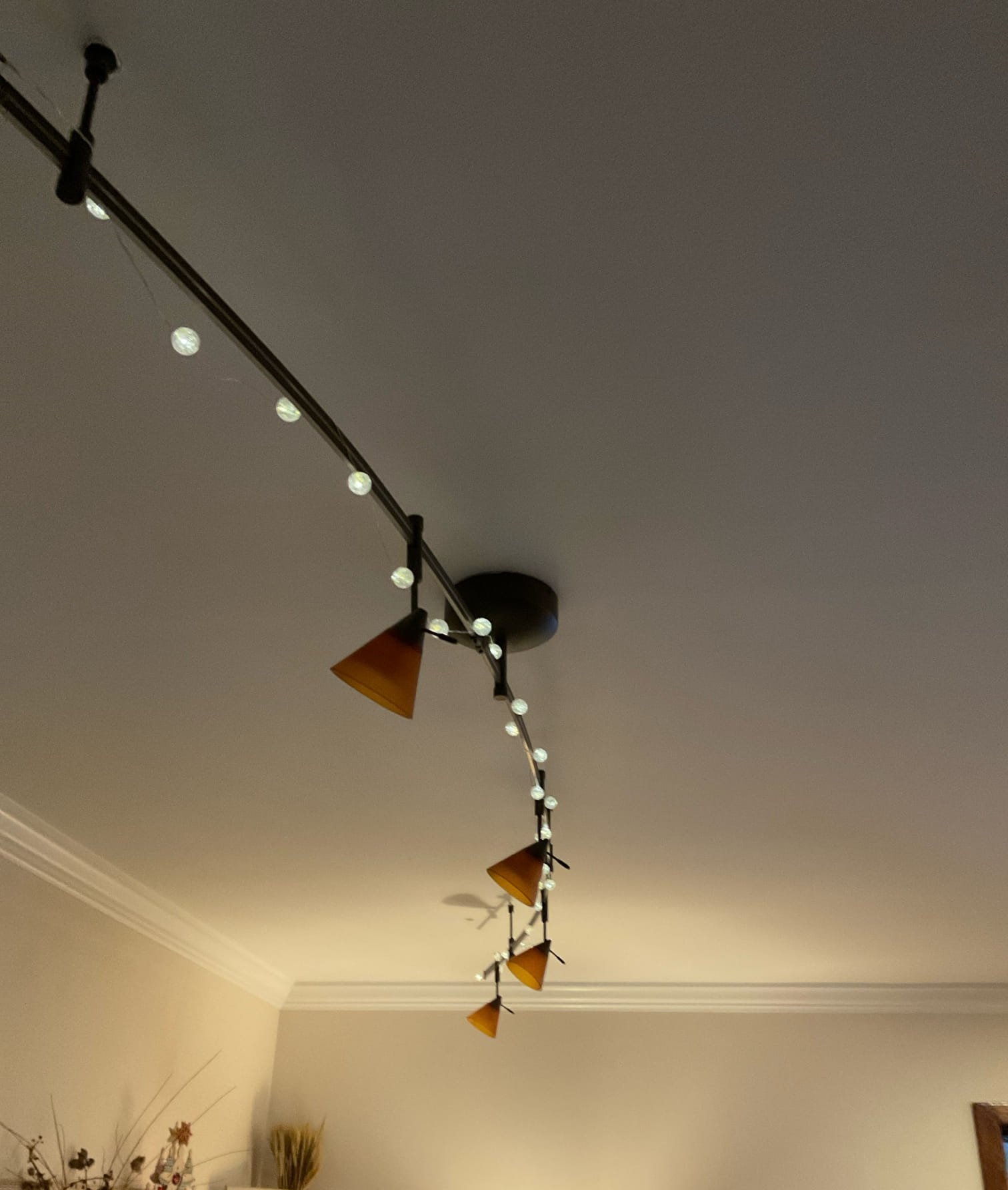 Thomas Edison Electric installed this flexible track lighting system with amber glass cone shades in a North Wales, PA living room. The adjustable heads allow the homeowner to direct light exactly where it is needed across the room.