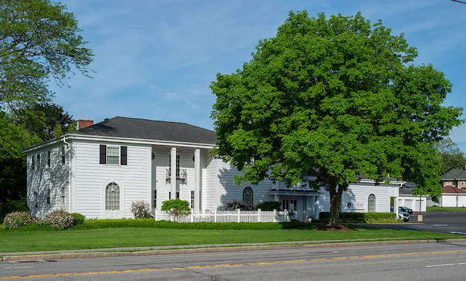 A street-level view of Anthony Funeral & Cremation's Brighton location on Monroe Avenue, framed by m 