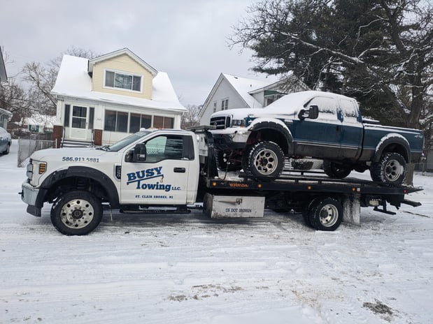 Images Busy Towing LLC
