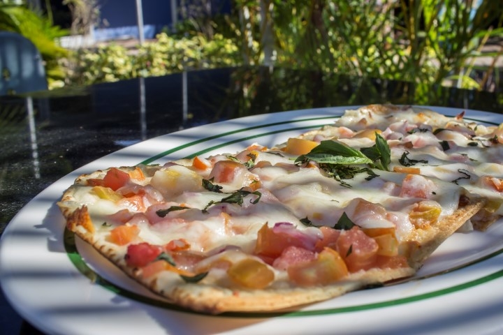 The Caprese Flat Bread, with fresh mozzarella, onions, diced tomatoes and fresh basil, at Marina 84 Sports Bar & Grill.