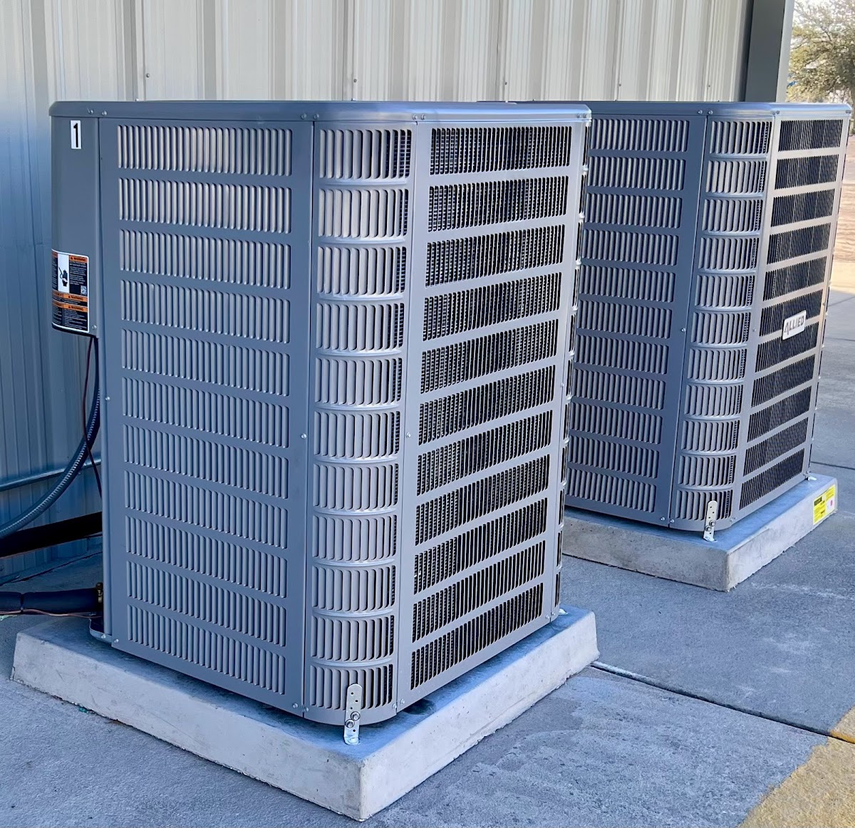 Multiple commercial rooftop HVAC units installed to provide reliable climate control and efficient cooling for the building.