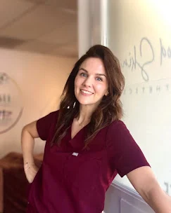Provider portrait inside the Good Skin Aesthetics clinic.