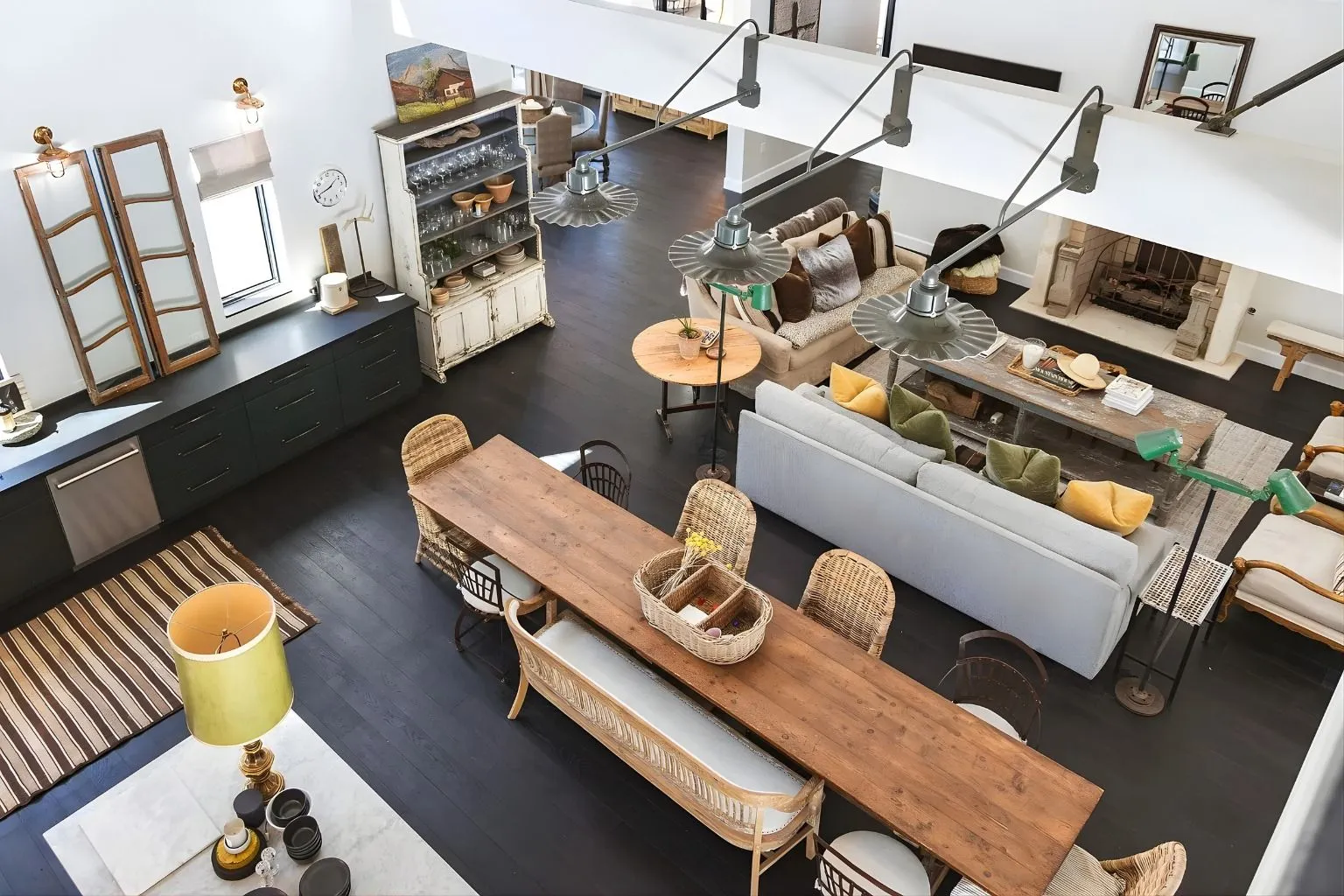 Custom-designed living, dining, and kitchen area featuring rustic finishes and modern amenities. Open layout creates a welcoming atmosphere perfect for entertaining and family gatherings.