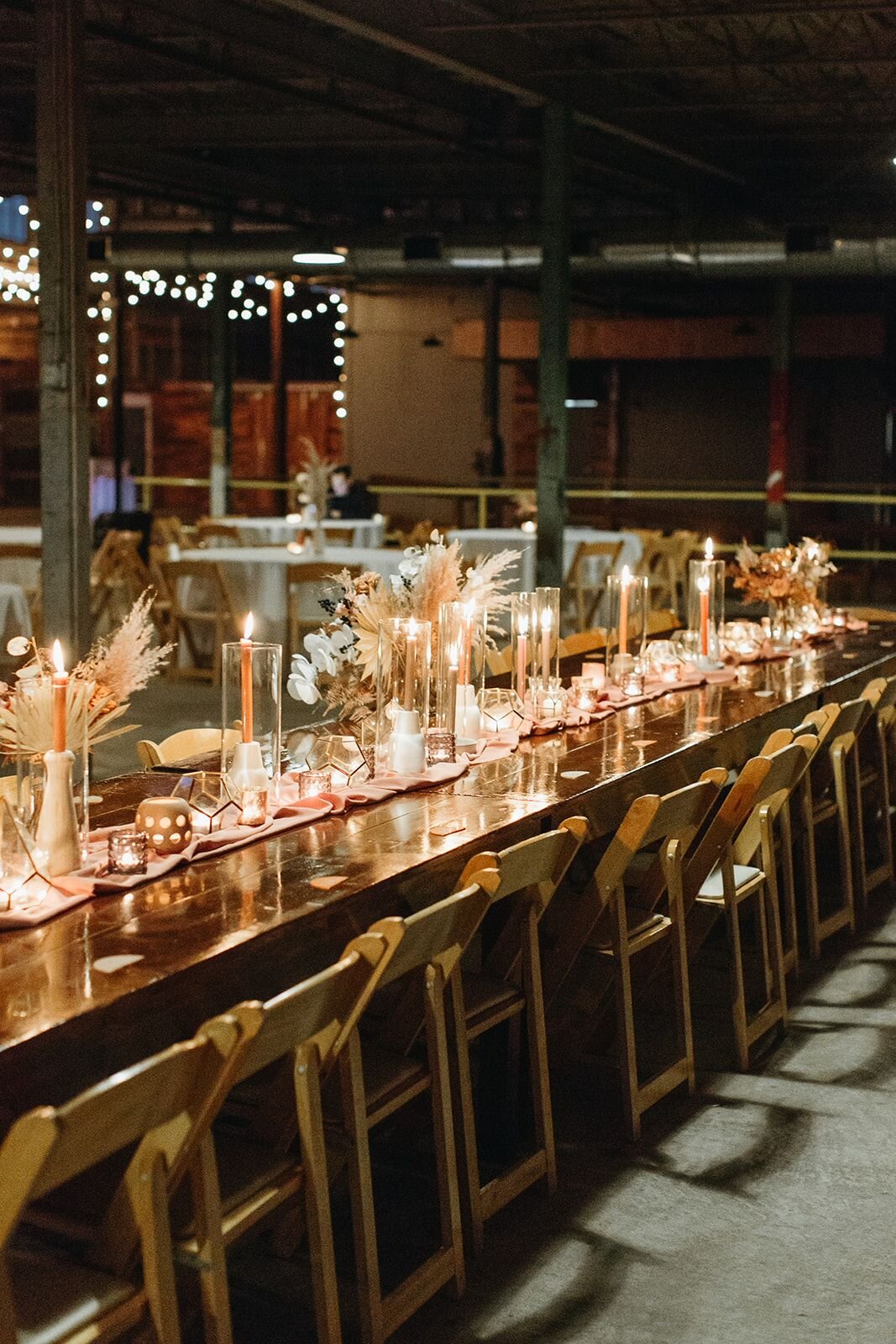 Elegant reception dining table setup for a wedding celebration at The Glass Factory.