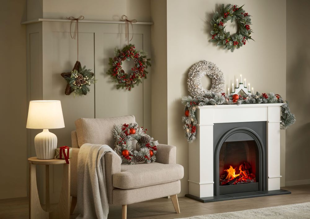 A living room adorned with Christmas decorations including wreaths & garlands