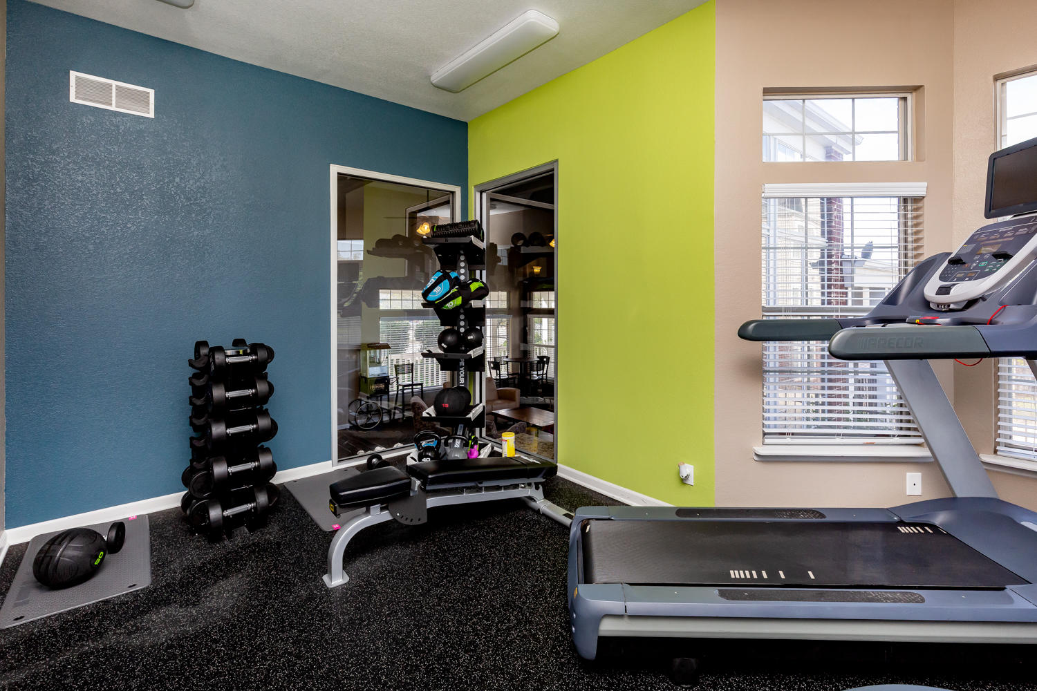 Treadmill and Free Weight Equipment at the Fitness Center