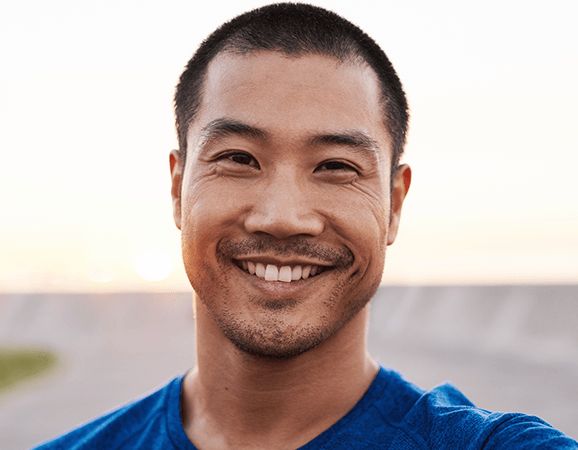 man smiling with fresh haircut from Hair Cuttery