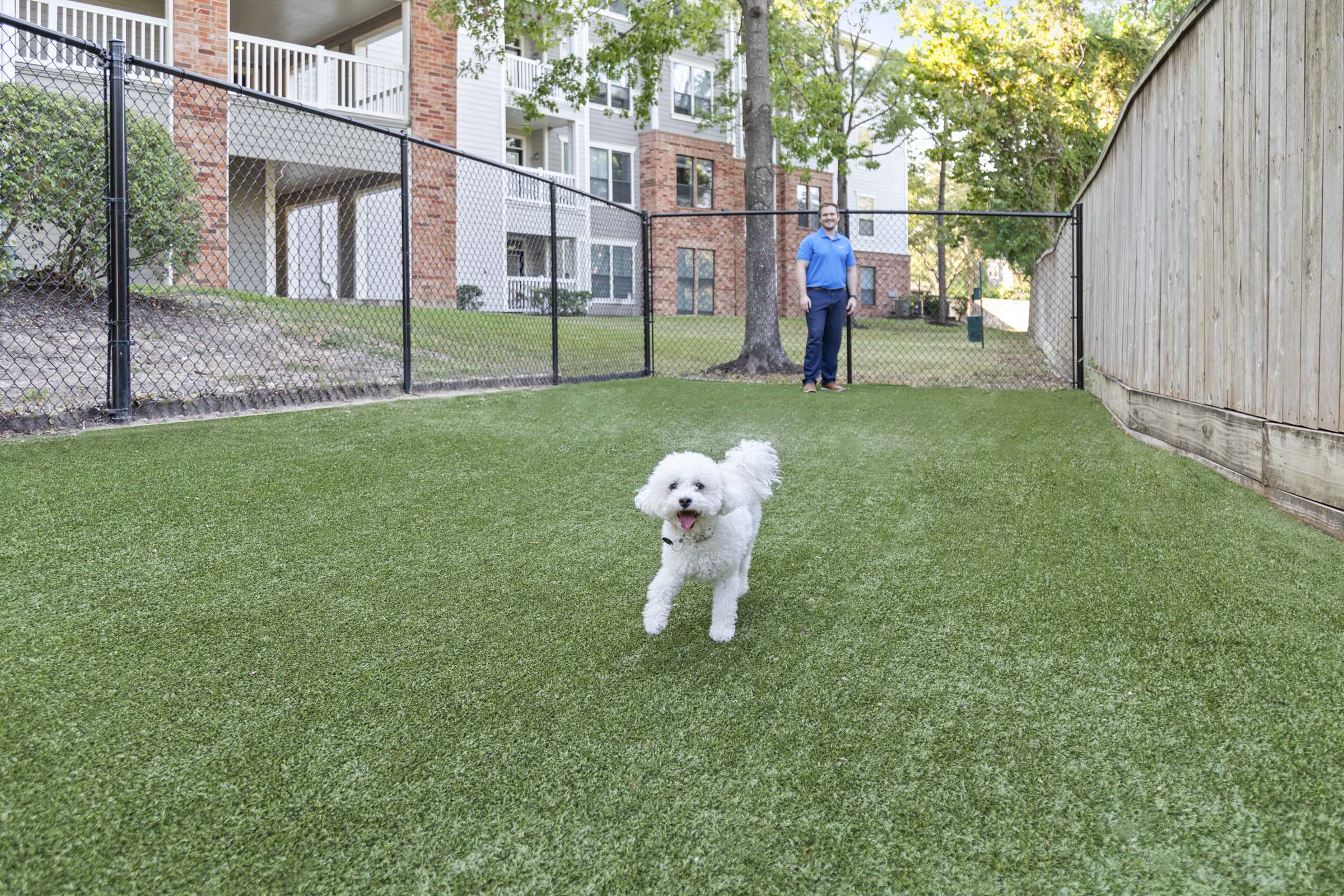 Onsite dog park with seating at Camden Heights Apartments in Houston, TX