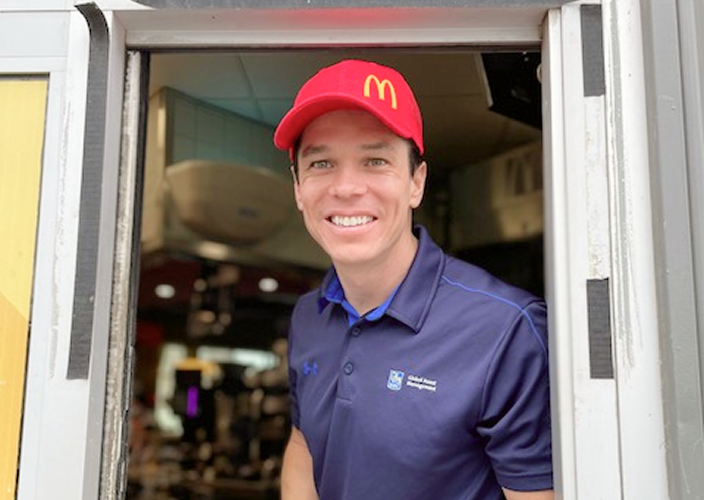 Dan Childerhouse standing at the McDonalds drive-through window.