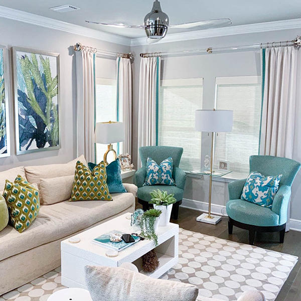 With so many color options, you can add our woven wood shades anywhere to match even the most unique home designs. For example, these beautiful all-natural woven wood shades match the furniture and artwork in this tropical-themed living room.
