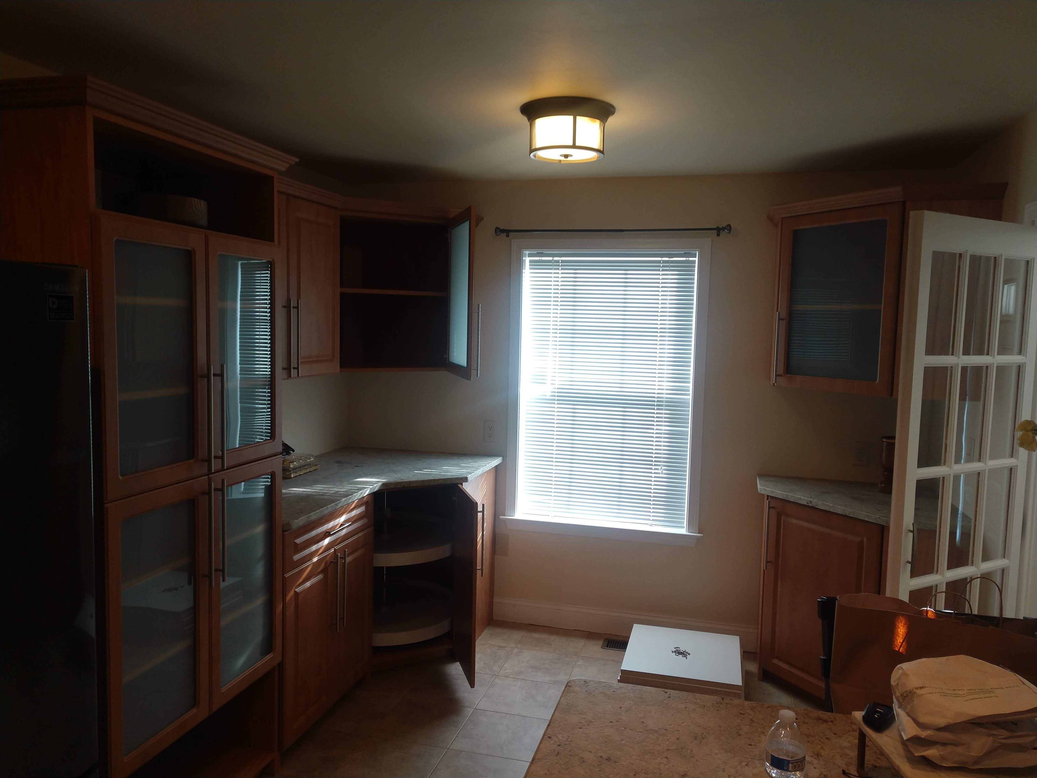 Custom kitchen cabinets in Harrisburg with crown molding to match existing kitchen