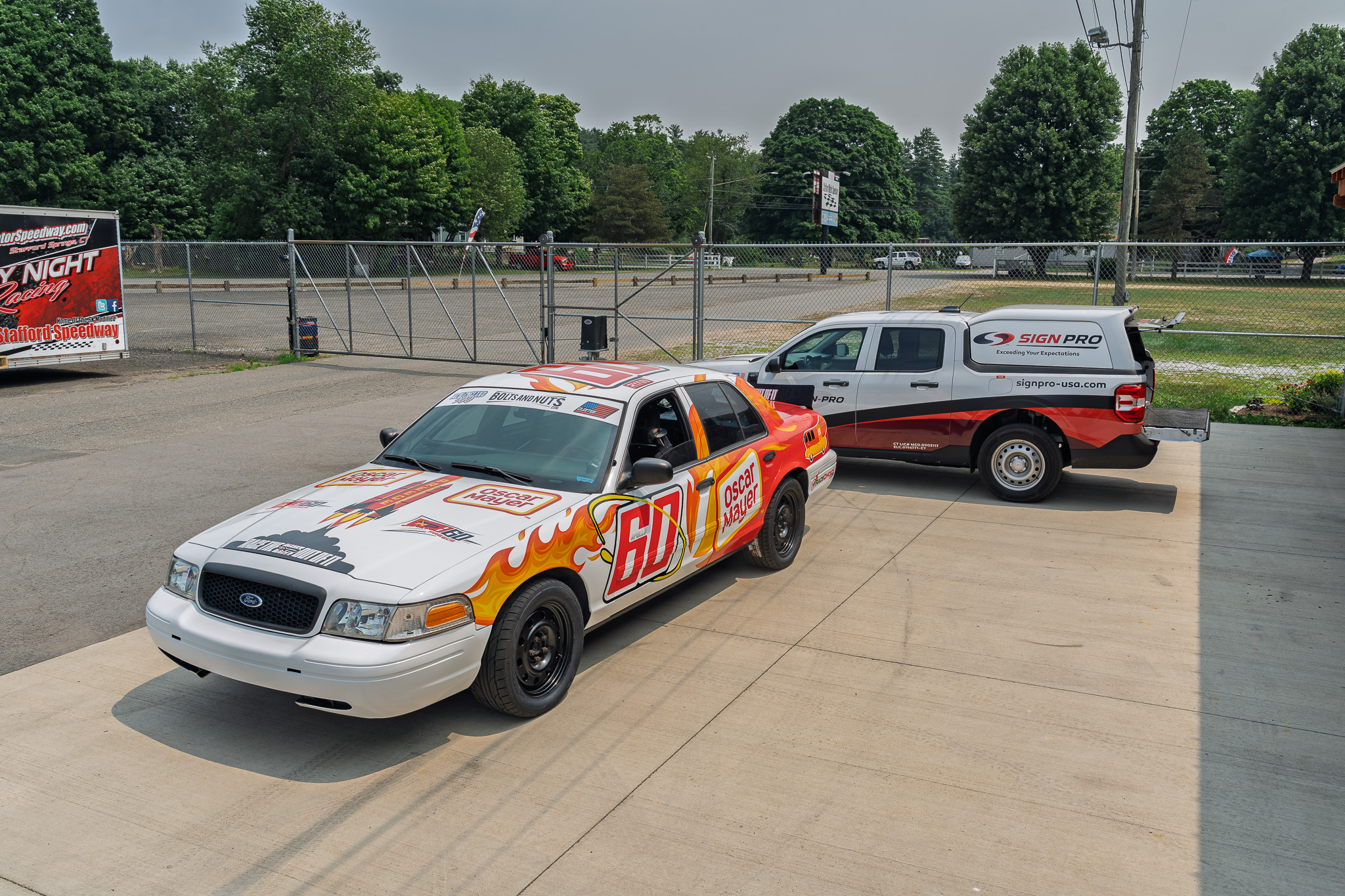 Custom race car vehicle wrap designed, printed, and installed by Sign Pro for driver Ryan Preece's #60 Ford Crown Victoria competing in the New England 900.