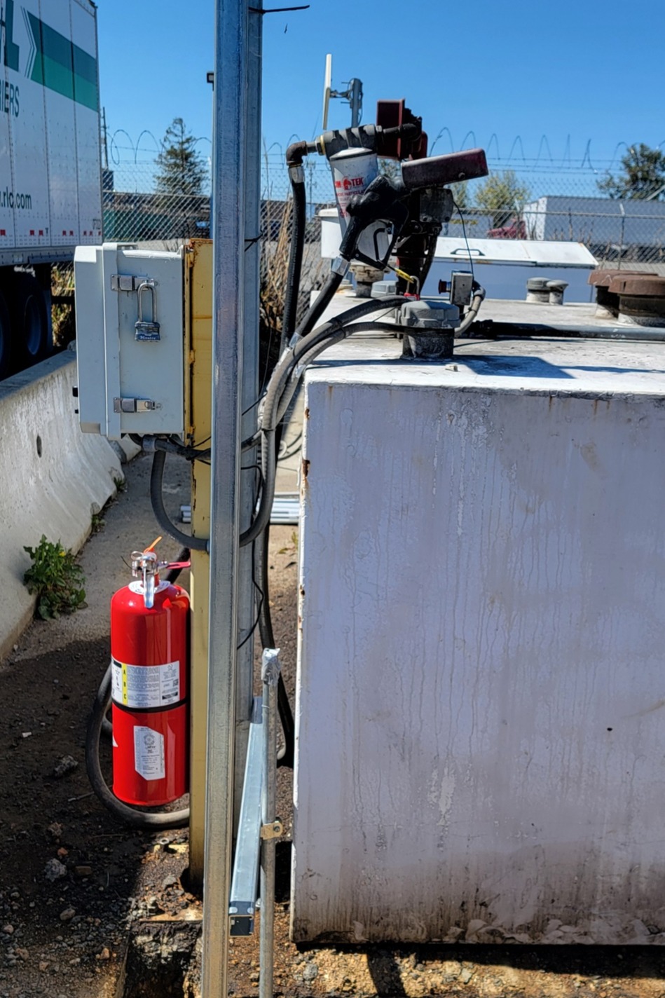 Replacing the existing unsafe electrical near a commercial fuel site.