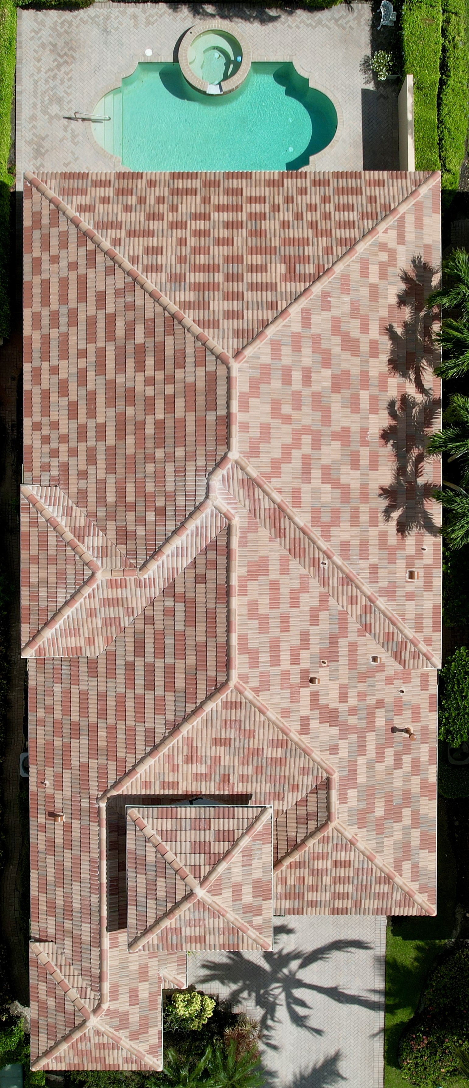 We replaced this roof and installed a custom blend of roof tiles from Eagle. The three colors we installed and blended together are called Sandy Bay, Boca Cream, and Terracambra Range.