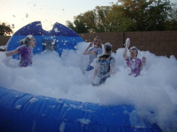 You asked for it????And Jump And Slide got it!!!!!! All new exciting Foam party rentals bring good clean fun to your event. Whether you are having a young kids party or celebrating a graduation, foam partie rentals on Long Island make everything more fun. 
Thick foam pumps out of the machine into the pit for everyone to dance and play in. 

The foam machine is placed at the back of the inflatable foam pit and pump piles and piles of thick luxurious foamy bubbles into the pit.  Once the bubbles pile up and the pit is full (20-30 min) it is time for the fun to begin!  The foam *can* stack up quite thick, so if you are hosting a party for smaller children, you will want to monitor the foam production and stop it every once in a while.
The foam is an all-natural hypoallergenic product similar to bubble bath. The foam powder produces the best foam on Long Island..

We are a one-stop shop for all your party and event rental needs! If you have any questions, please do not hesitate
to give one of our event specialsts a call at 631-321-7977
ADULT SUPERVISION IS REQUIRED 100% OF THE TIME WITH THE FOAM PIT. THERE IS NO DIVING ALLOWED. THE FOAM PIT IS NOT A POOL! AND CONTAINS MINIMAL WATER.