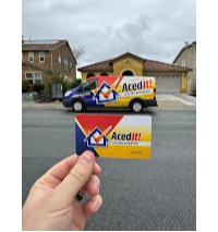 Aced It! Cooling & Heating branded van parked in a residential neighborhood, featuring the company's bold logo with blue, red, and yellow colors. In the foreground, a hand holds a business card showcasing the same logo and vibrant design. The image highlights the professional branding and local HVAC services provided in Corona, CA and surrounding areas. Ideal for showcasing trust, reliability, and visibility in the community.