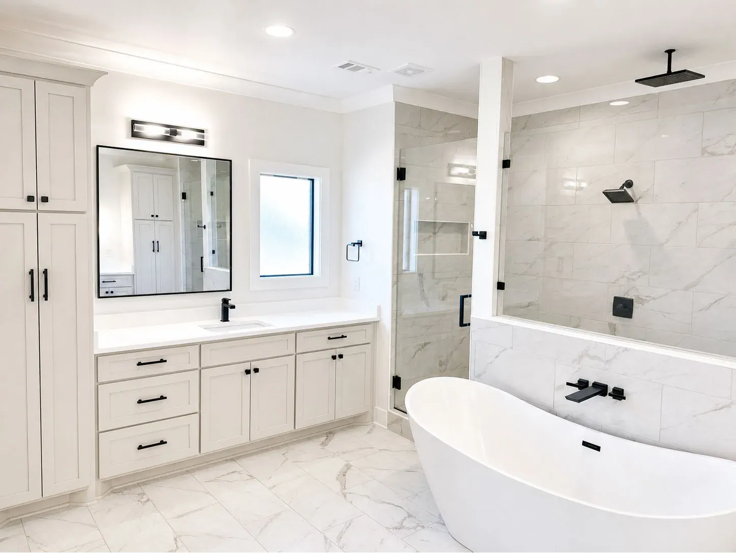 Spa-Like Master Bath Oasis: Features a modern freestanding soaking tub, dual-head walk-in tile shower, and sleek matte black fixtures.