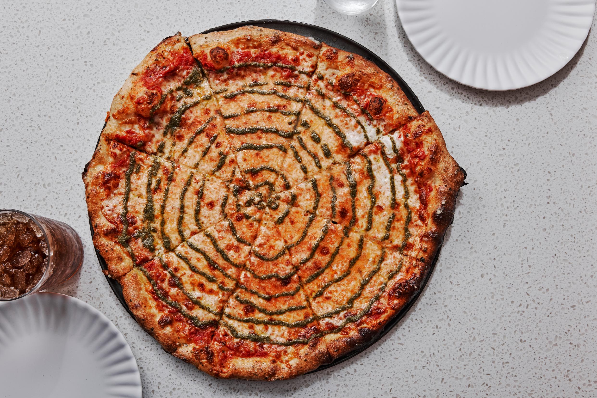 Red Sauce, Mozzarella, Basil Pesto pizza at islamorada pizza co