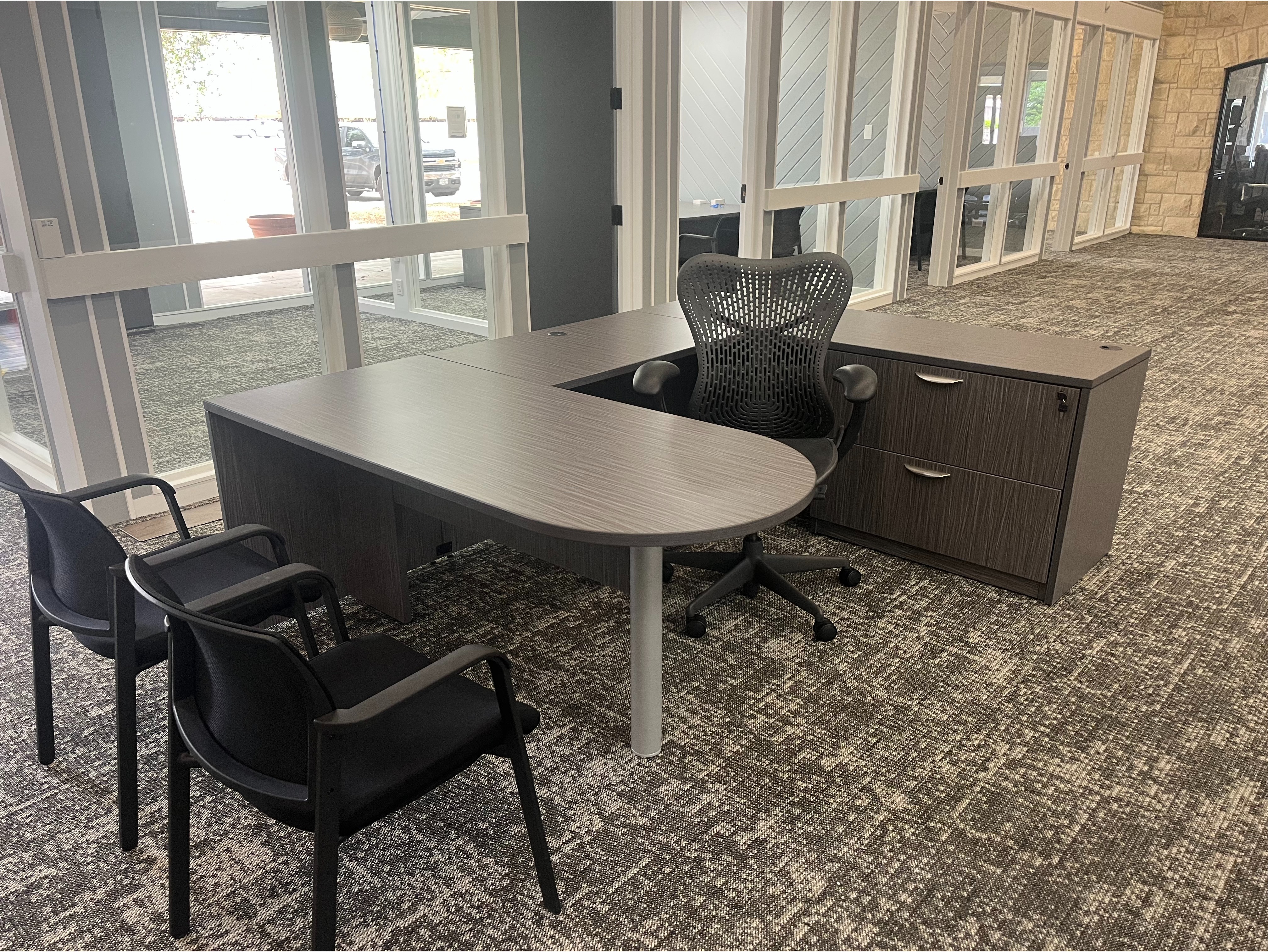 Executive Desk Suite:

Full L-shaped executive office desk with modesty panels, pedestal drawers, and matching overhead storage Hutch in a warm walnut finish.