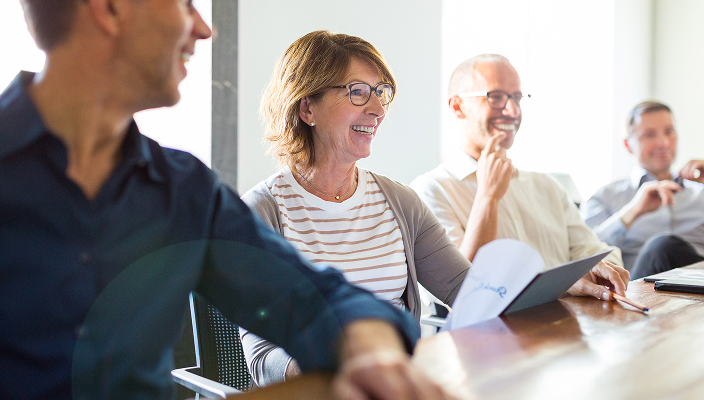 Client family at a boardroom table.