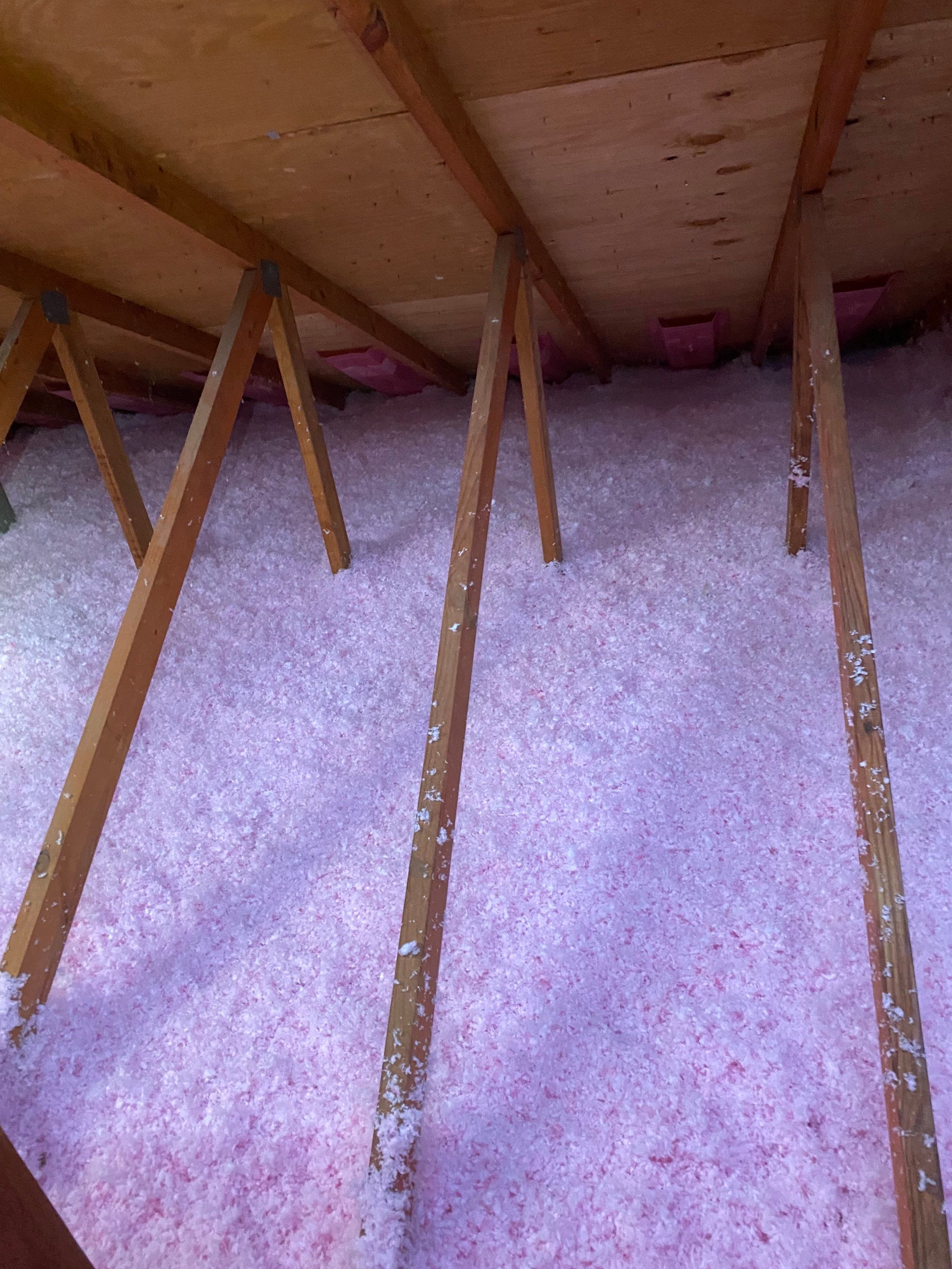 Attic insulation installation by Home Genius Exteriors – Boosting energy efficiency and reducing utility bills.