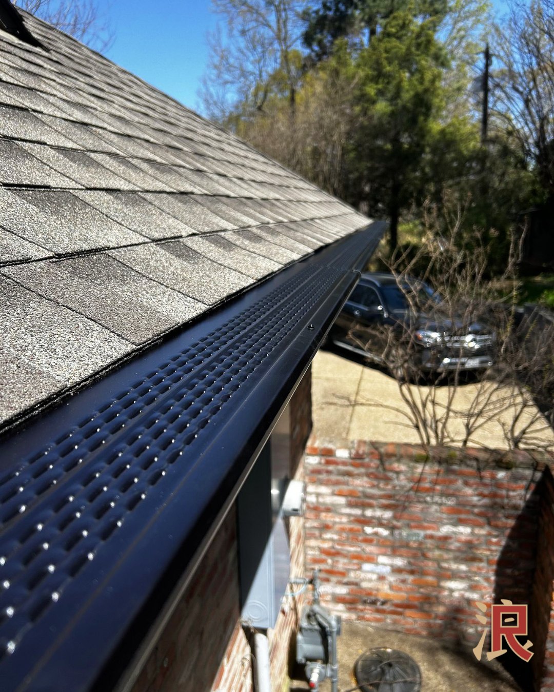 Gutter guards installed on a shingle roof 