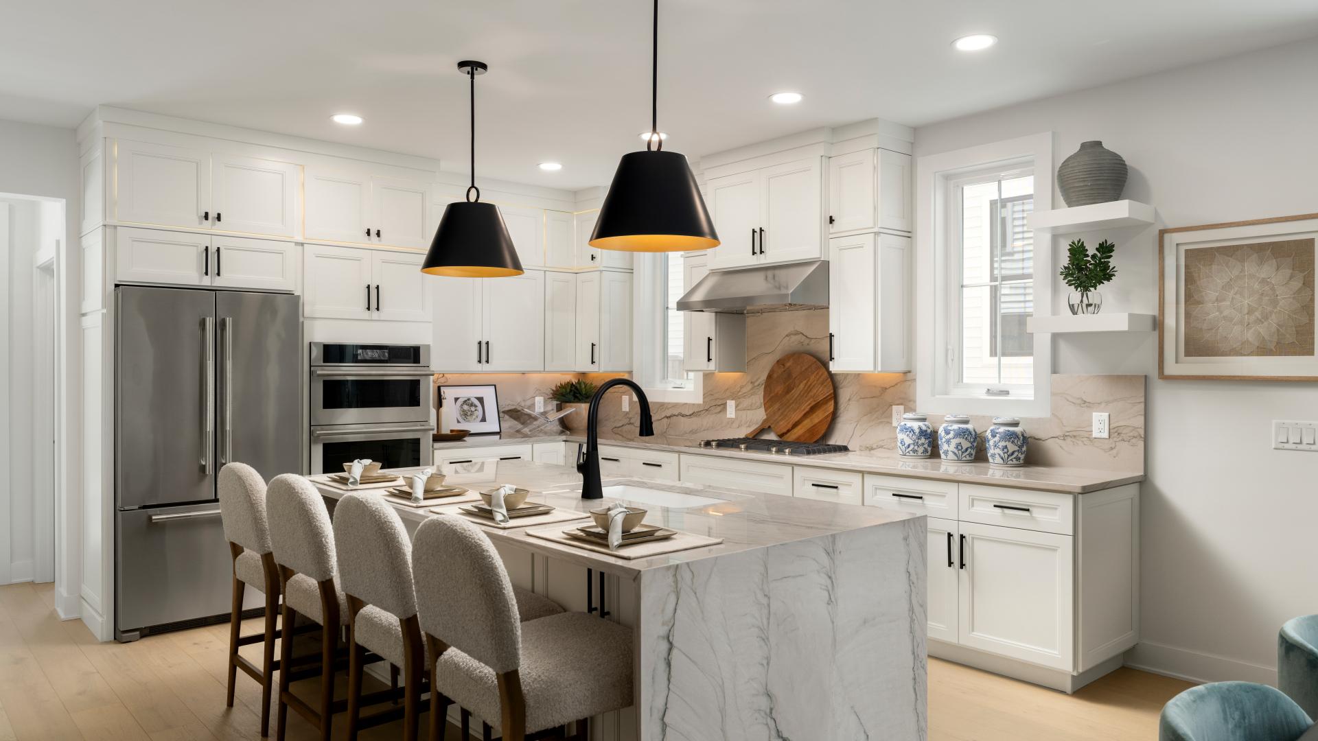 Gorgeous kitchen boasts a large center island and stainless steel appliances