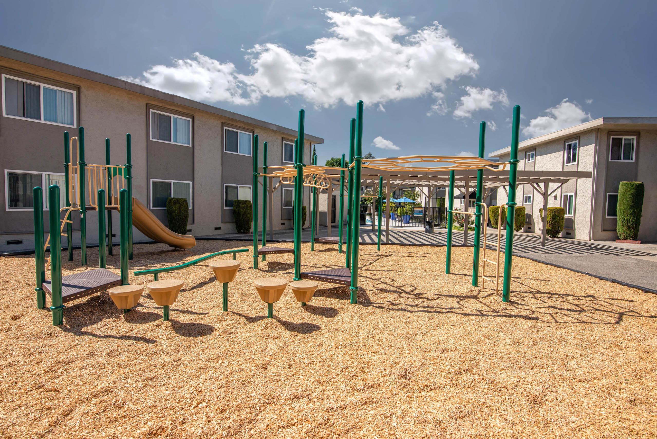 Monterey Manor playground between apartment buildings.