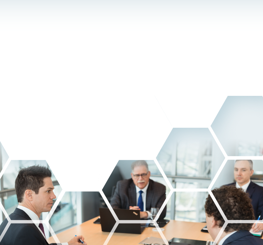 The Winestock Childerhouse team collaborating around a boardroom table.