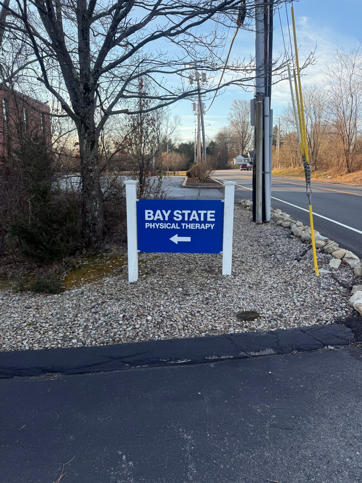 RI-Lincoln Bay State Physical Therapy sign outside of building with logo.