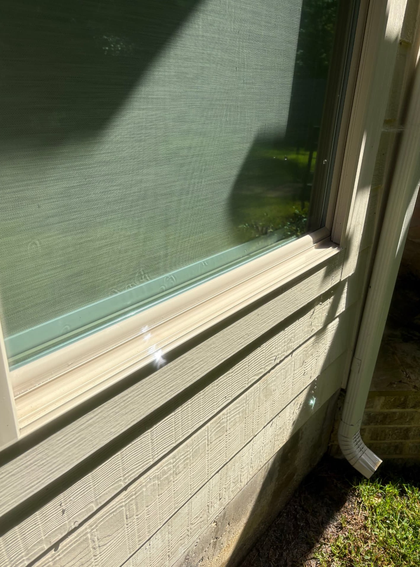 Professionally cleaned window sills with dirt, dust, and buildup removed, showcasing detailed window cleaning services in Conroe, TX by Integrative Soft Wash and Property Services.